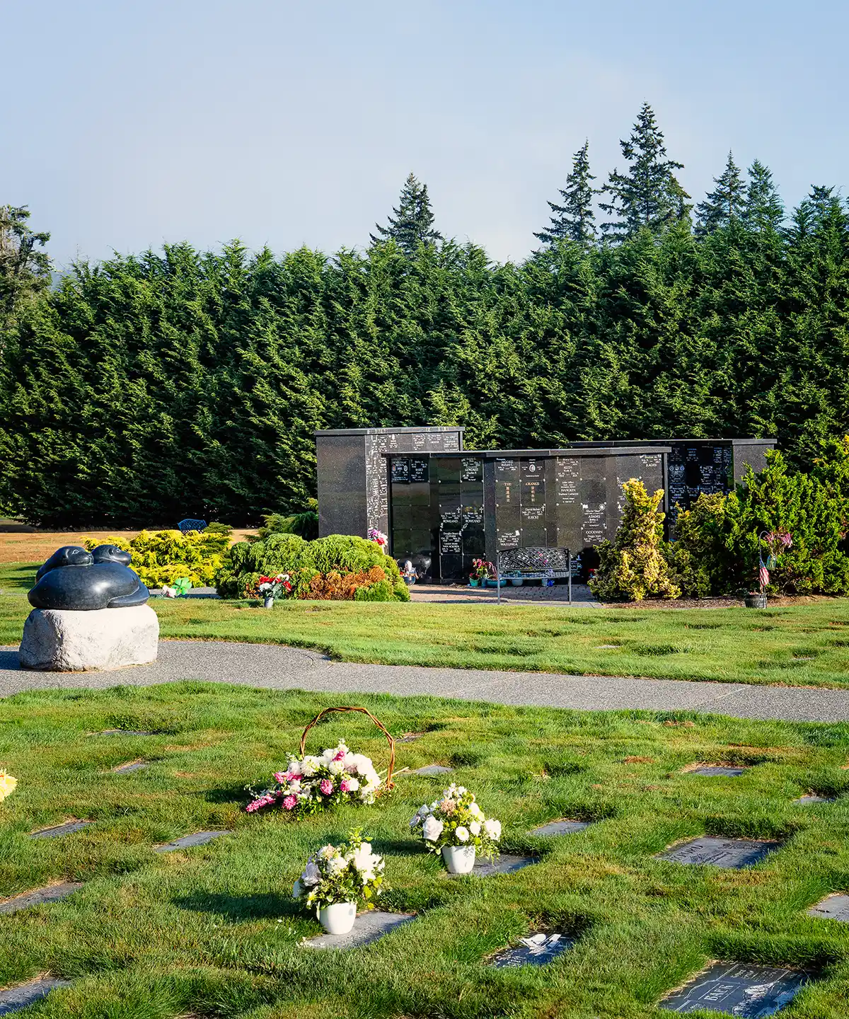 Memorial grounds with flowers and mausoleum crypts